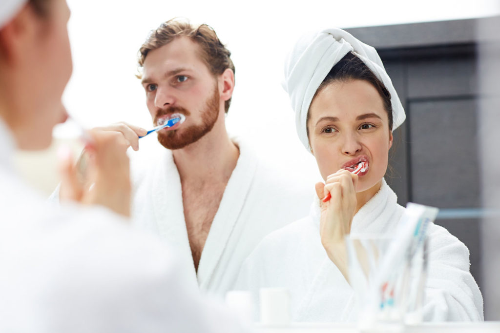 Couple Brushing teeth